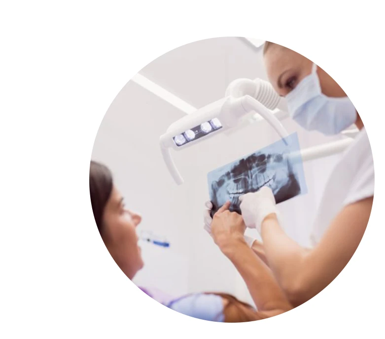 Dentist showing patient x-ray results