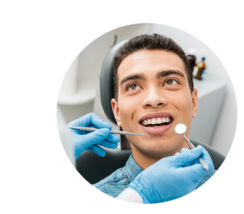 cheerful african american man with during examination in dental clinic