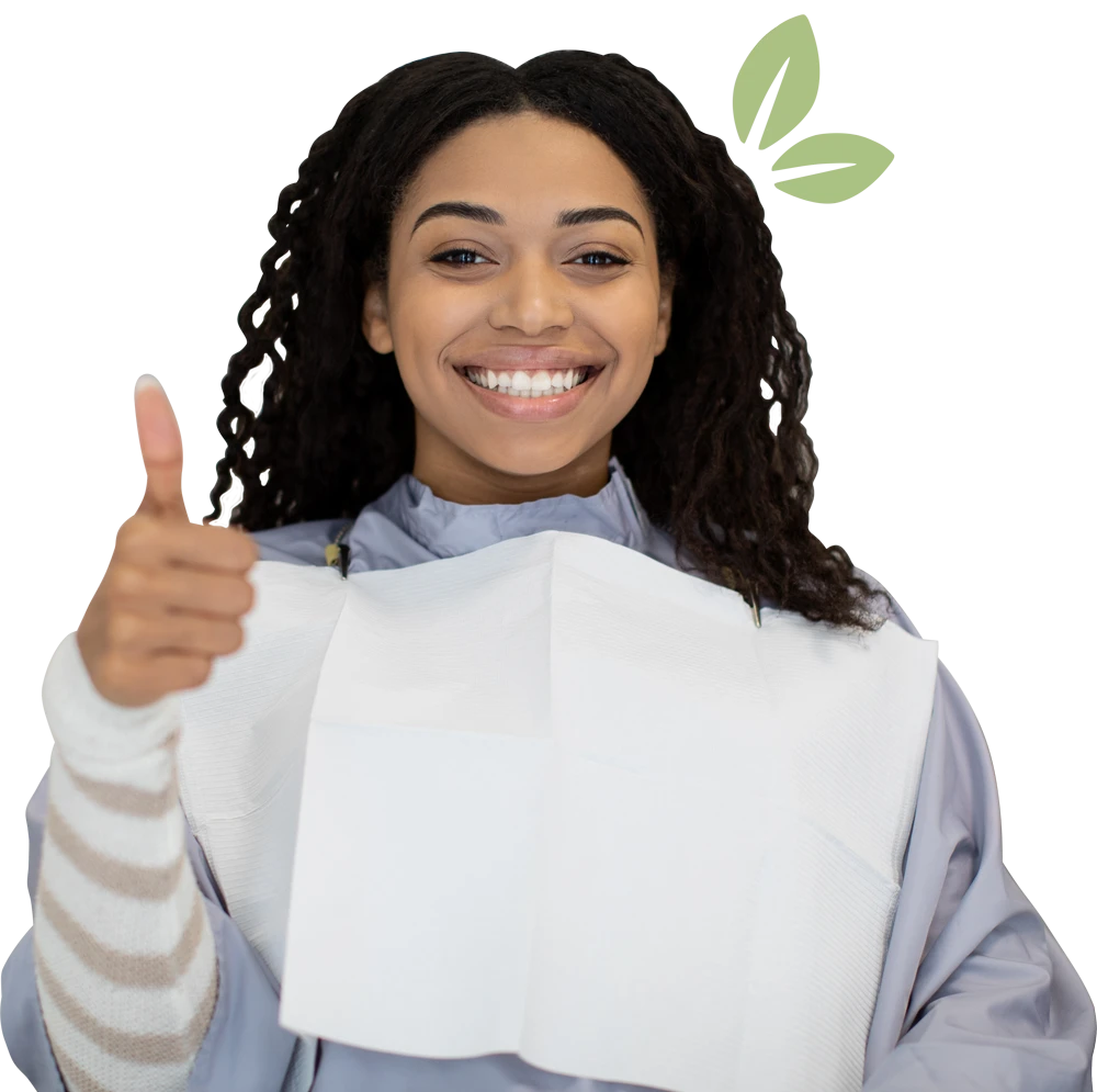 Portrait Of Beautiful Smiling Black Female Patient Smiling And Showing Thumb Up After Dental Treatment