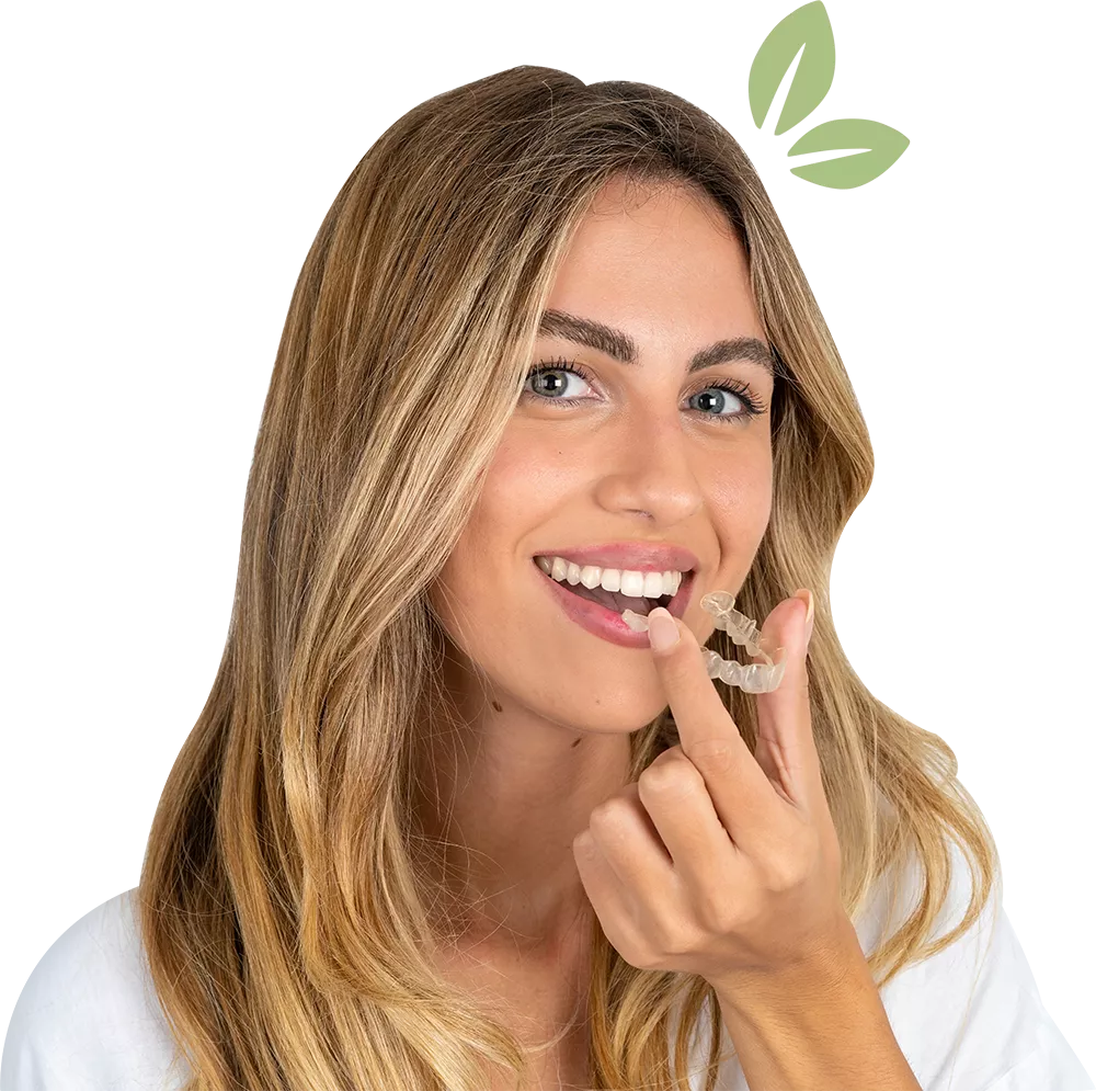 Young beautiful caucasian woman over white background holding an invisible aligner ready to use it.